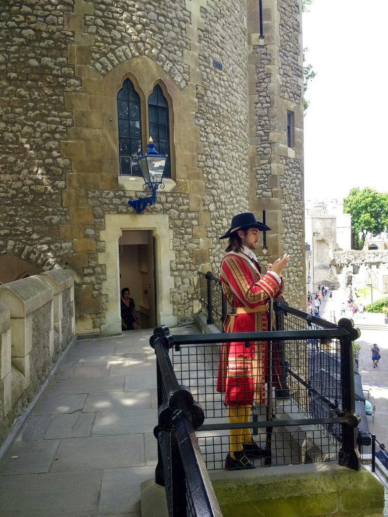 actor in medieval costume on the ramparts at the Tower of London